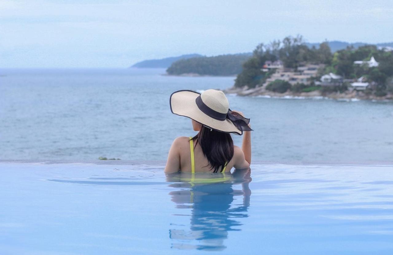 The Shore At Katathani - Adult Only - Sha Extra Plus Экстерьер фото A woman wearing a sun hat