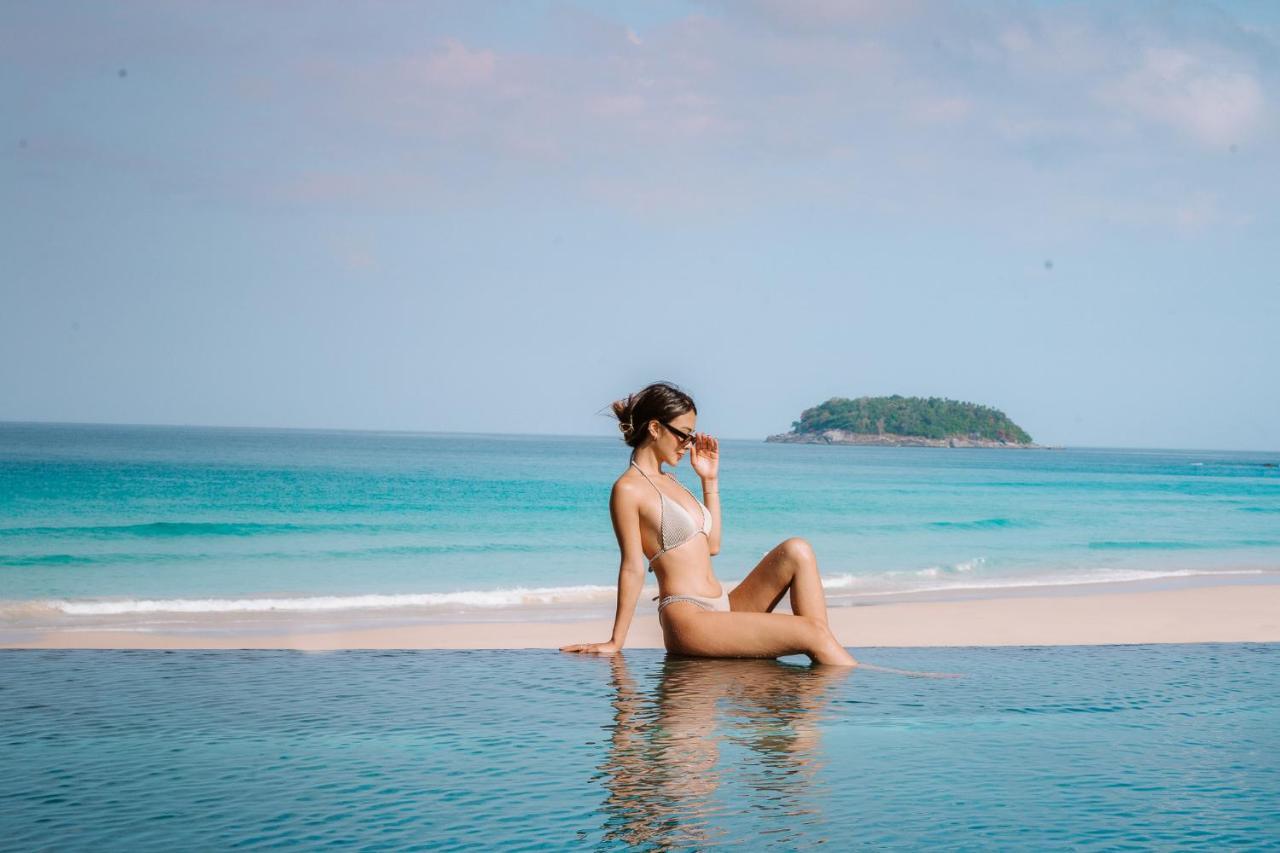 The Shore At Katathani - Adult Only - Sha Extra Plus Экстерьер фото A woman sunbathing on a beach